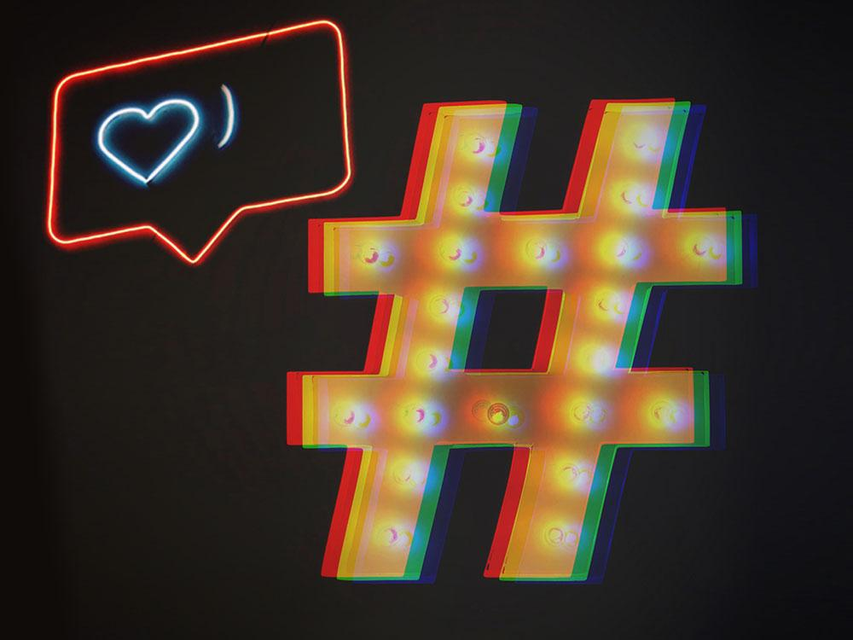 instagram heart and hashtag with neon lights