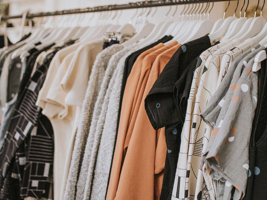 Variety women clothing hanging in the store